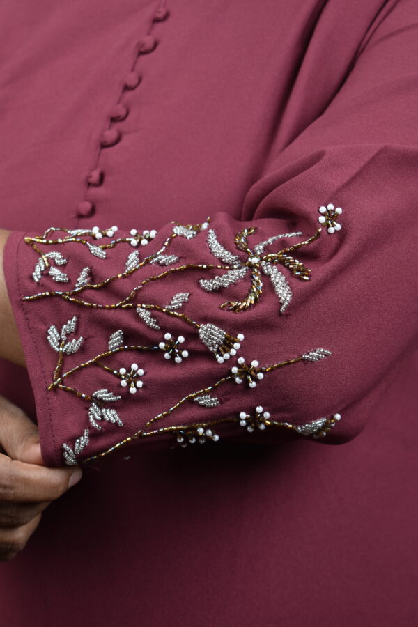 Code:SR156  Faux georgette top.. Hand embroidery worked sleeves..